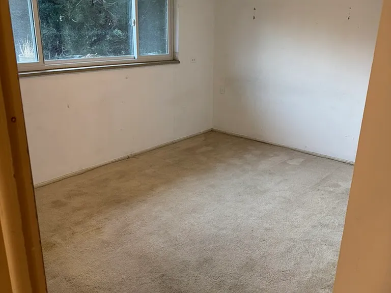 Lower garden level bedroom 13.5' x 10' with street and mountain view - west facing