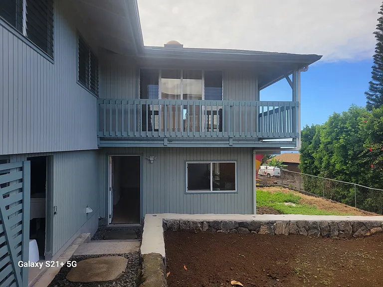 View of the storage area, bonus room and upstairs living room/balcony.