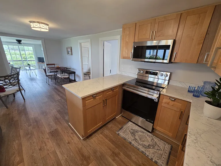 Kitchen with view to dining area and living room
