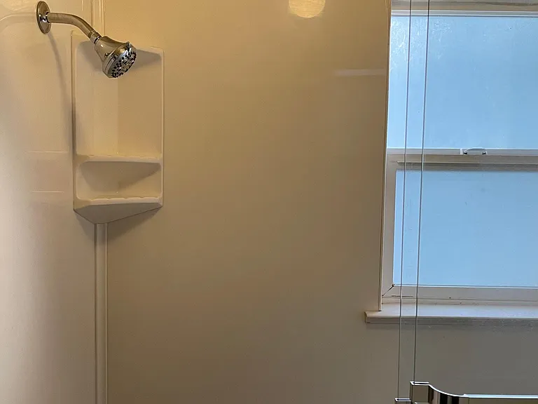 A view of the new shower head in the upstairs bathroom area, installed in 2019.