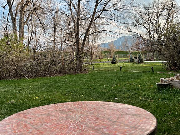 Enjoy coffee and views of the Flatirons from the side yard