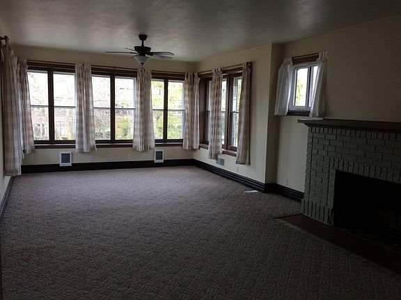 HUGE living room with lots of windows overlooking nice neigh