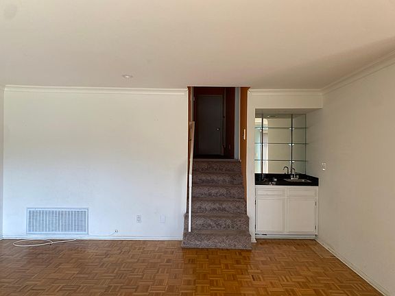 Wet bar. Stairs to hallway to bedrooms and bathrooms