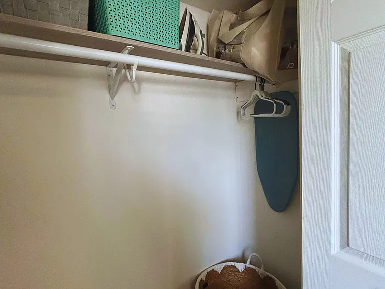 Stay organized with a spacious closet, iron, and ironing board.