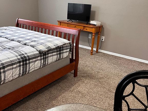 Elevate your living experience effortlessly! Say goodbye to the hassle of TV shopping, as this room boasts a ready-to-use television for your entertainment needs. Enhance your productivity with a dedicated desk, just awaiting your personal touch with a co