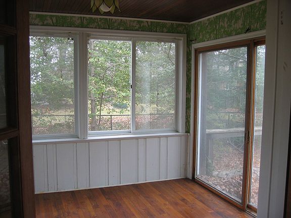 Sunroom with Newer Windows and Hardwood Floors