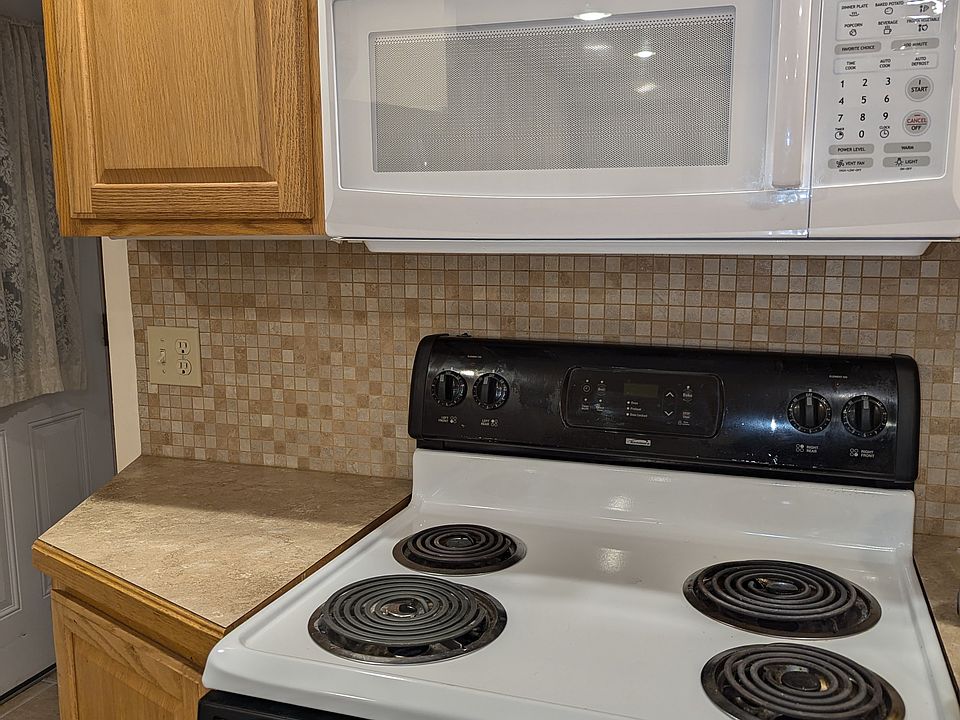 Kitchen with oven and microwave