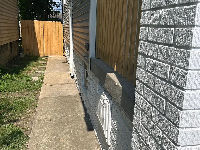 Side path leading to backyard