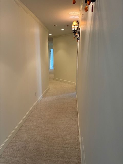 Dramatic hallway to extremely large bedrooms and baths. New paint and carpet.