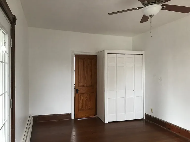 Large bedroom with French doors to private deck