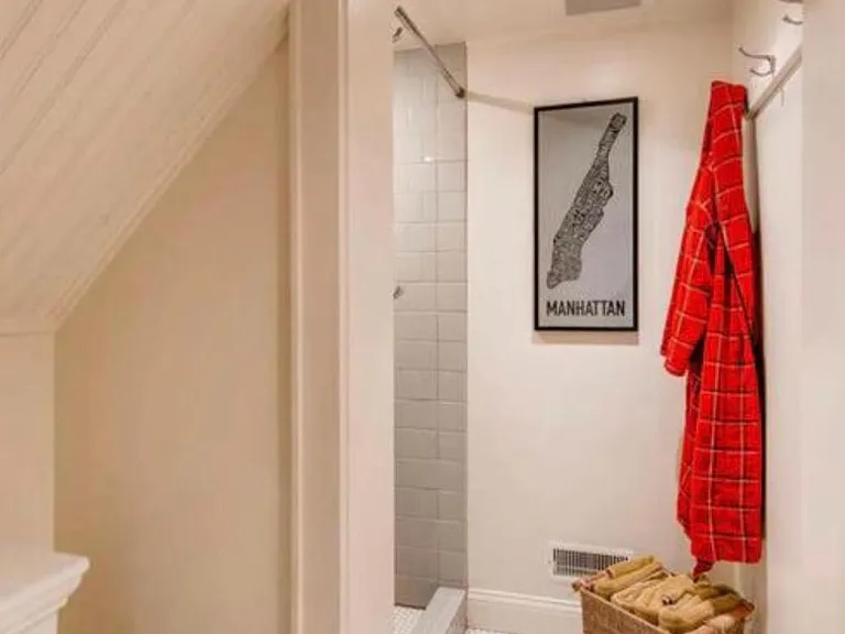 The lower level bathroom provides a newly finished walk-in shower.