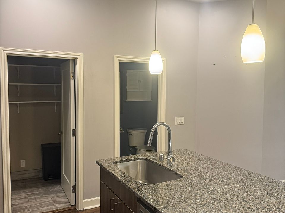 Kitchen with 1/2 bath and laundry/pantry.