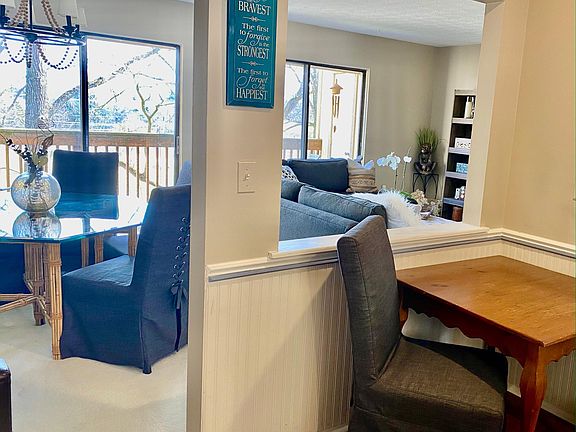 Natural light throughout spacious, open living room and kitchen.