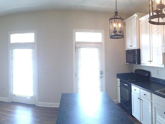 Open concept kitchen/living area with island.