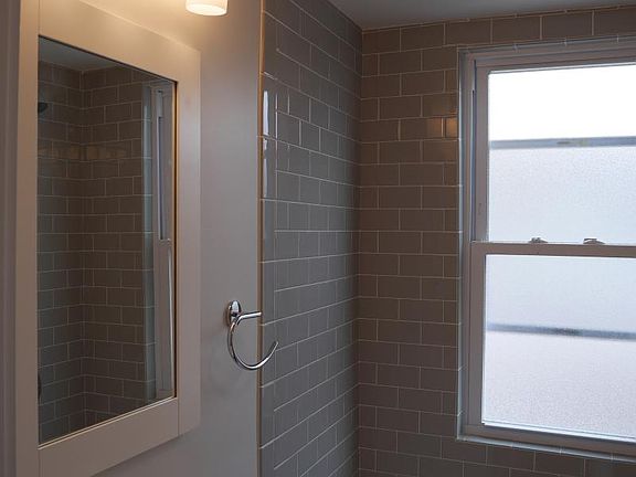 All new bathroom featuring custom grey subway tile, modern c