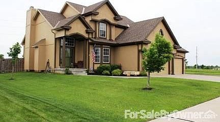 Front View from Street
						:
						Professional Landscaped Yard.