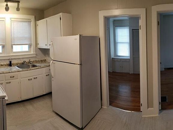 Panoramic View of eat in kitchen. Walls are straight, not curved.
