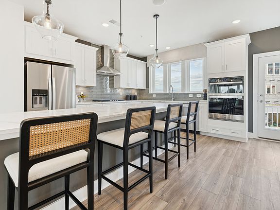 Kitchen with Expansive Island and Stainless Steel Appliances