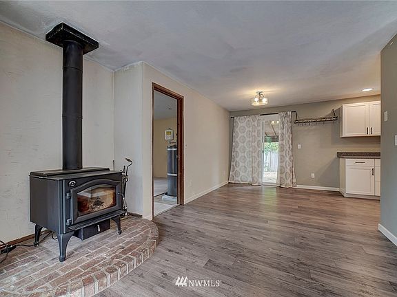 New woodstove and laminate flooring.