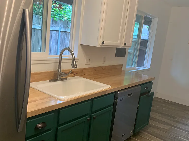 Kitchen Sink, Dishwasher, a peek at the breakfast nook in the back