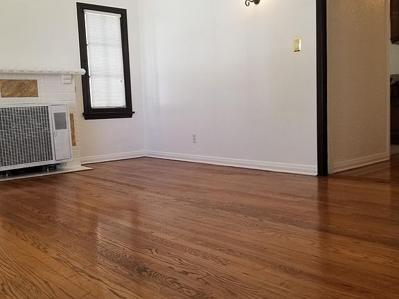 LIVING ROOM HAS HARDWOOD FLOORS, MINI BLINDS