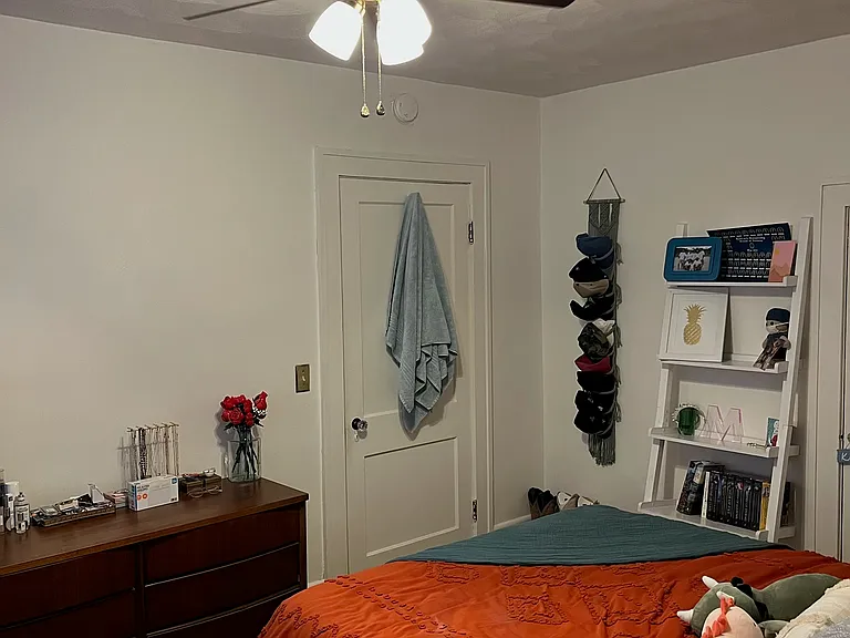 Bedroom One w/ Designer Ceiling Fan and Two Large Windows.
