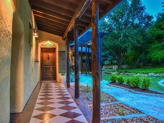 The front entry is through the courtyard gate.  This home was designed with an east/west orientation to maximize views, light and airflow.
