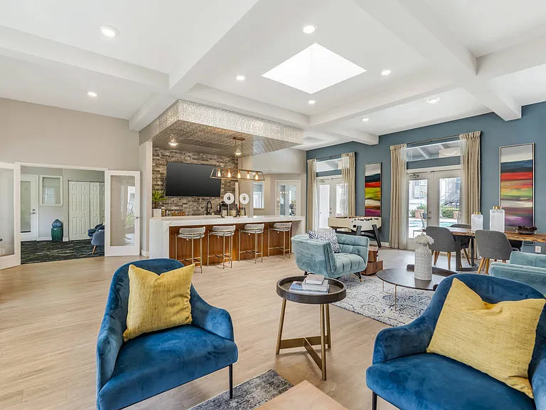 The leasing clubhouse welcomes all residents with plenty of seating and a cozy coffee barperfect for relaxing, socializing, or getting some work done.
