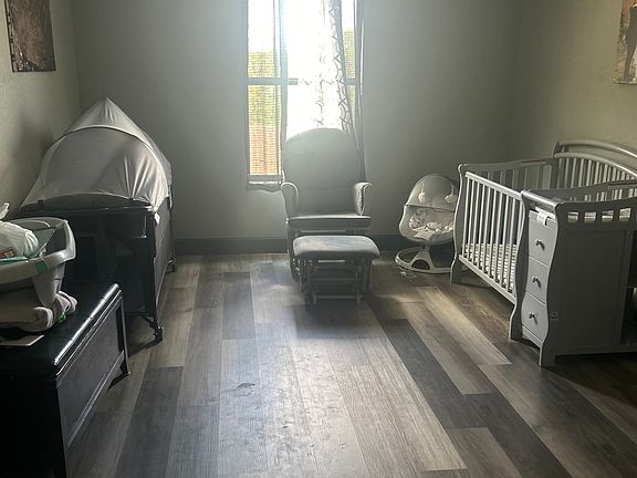 One of two guest bedrooms both same sq foot and same size closet as master .