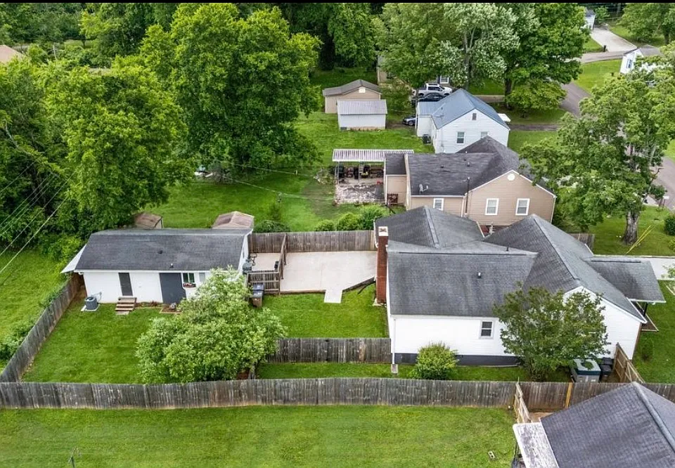 aerial view main house on the right, separate privately fenced ADU on left