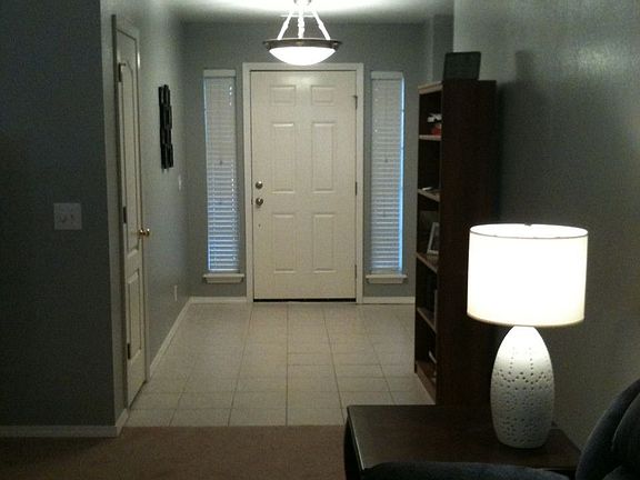 Front foyer with tile entry and coat closet