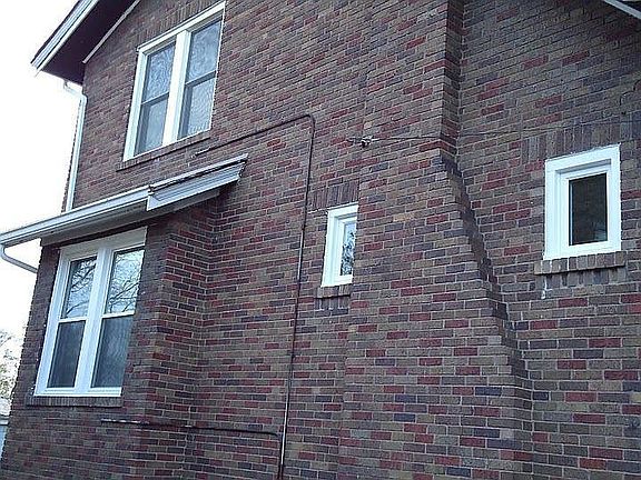 Ancient Wood Windows were replaced with modern energy-efficient vinyl ones