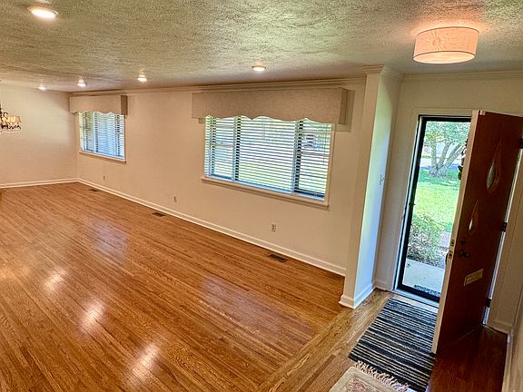 Great room and dining room near the front door.