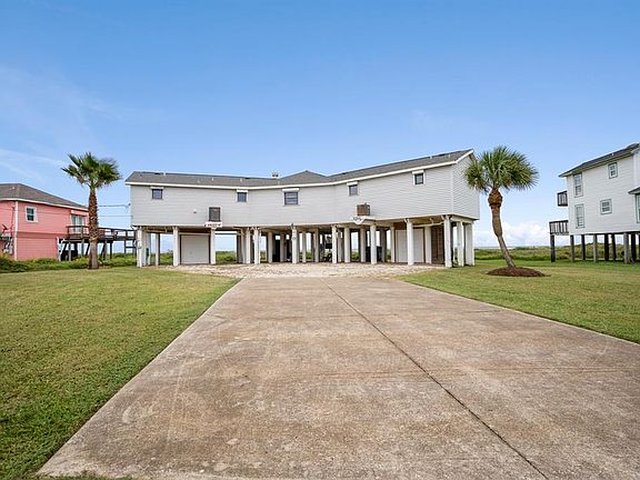 Panoramic gulf views from windows galore of this delightful beachfront home. Parking galore for family and friends, a wonderful place to entertain.