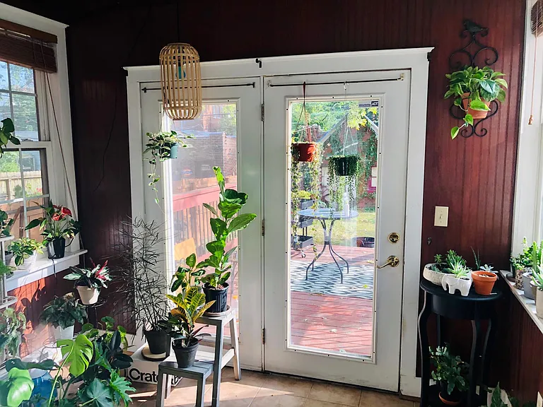 Sunroom with view of deck