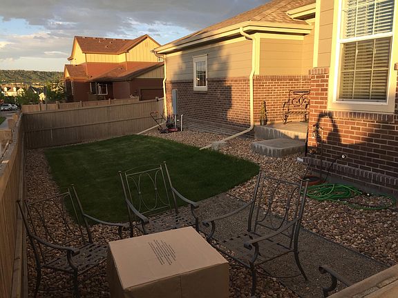 Fenced, side yard with sprinkler system.