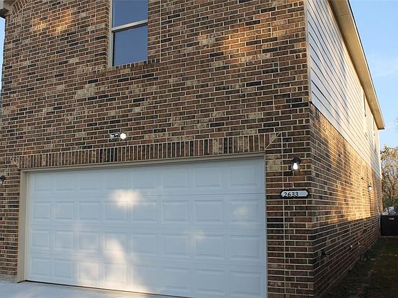 2633 Front St is complete with a two car garage that is completely painted and equipped with a garage door opener.