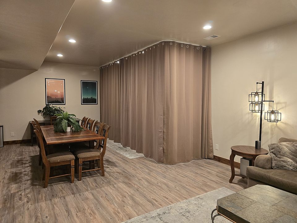 Living area with curtain drawn around the Murphy bed.