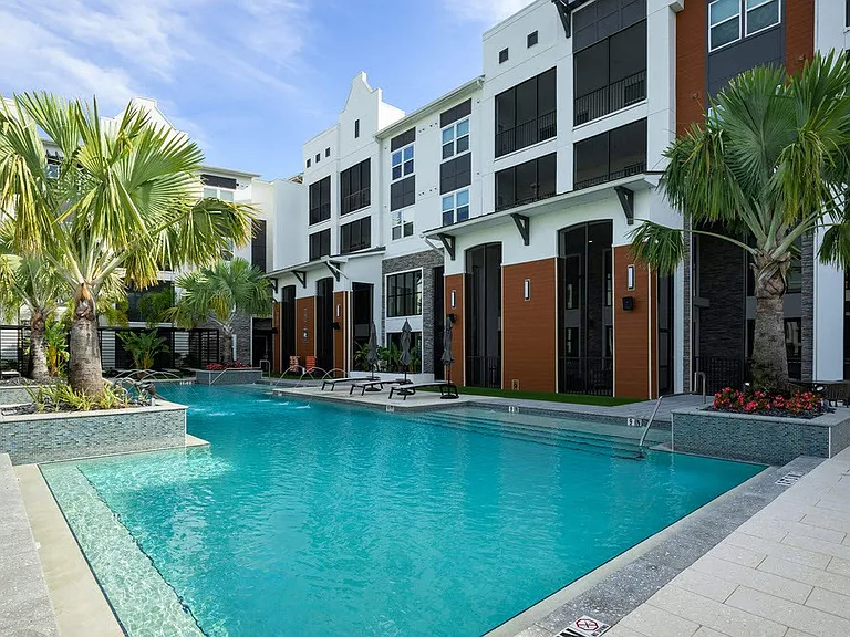 Unwind in the stunning pool area of The Edison Daytona Apartments, where modern design meets tropical charm. Enjoy a refreshing dip or relax poolside in a serene atmosphere. Schedule your tour today and elevate your lifestyle!