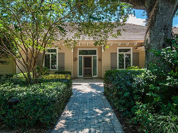 Front w/ patio & driveway