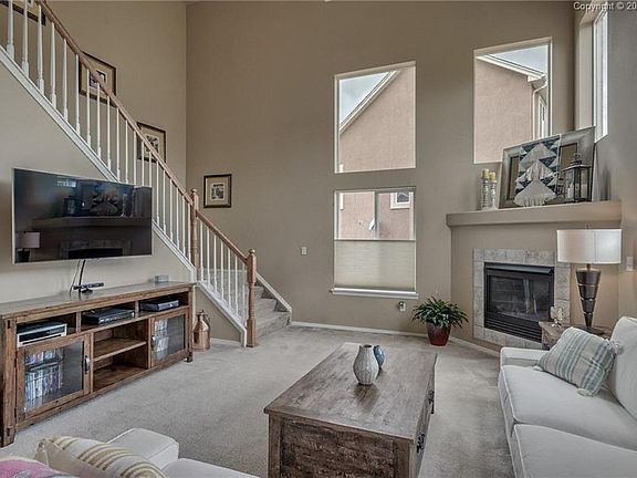 Unique dual staircase off the great room adds an additional WOW factor to this s