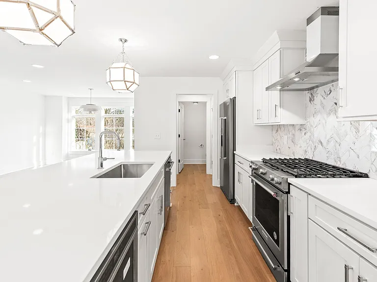 half bath at the end of the hall, pantry on the left, gas oven