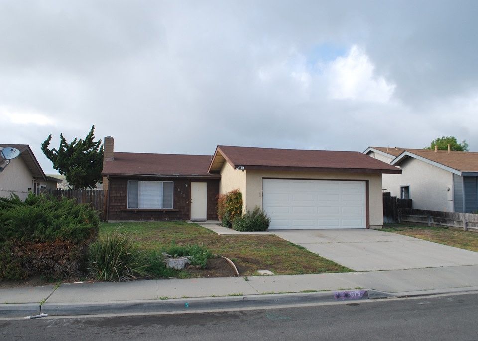 Front with 2 car garage