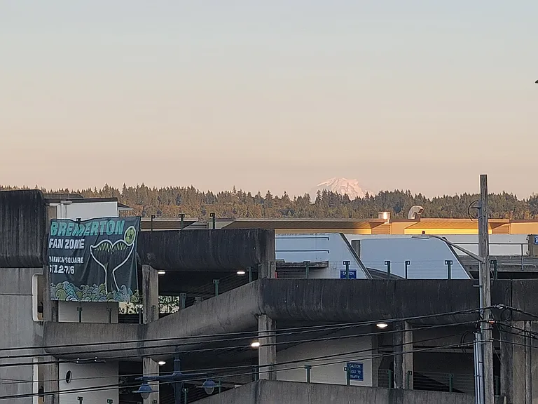 Local paid parking garage for overflow guests and Mount Rainier in the distance.