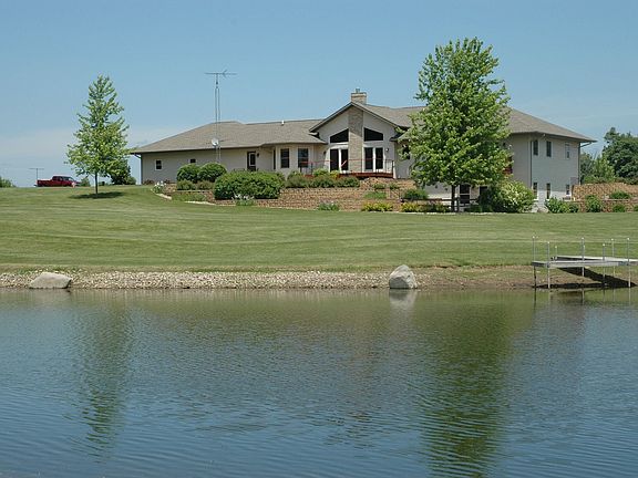Rear View of Home with Pond