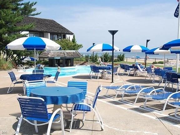 Pool deck with umbrellas and chairs