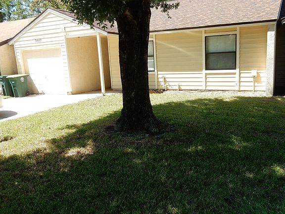 Nice front yard with shade tree.