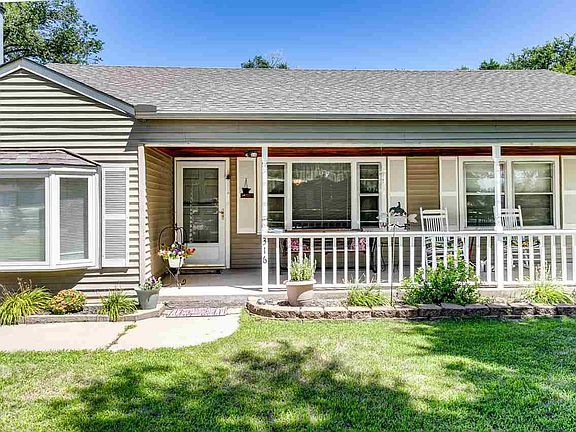 Morning coffee or cool evenings are best spent on this sweeping porch.