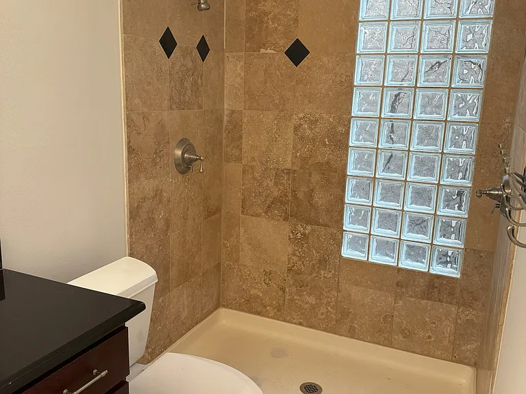 Stand up tile shower in the secondary en-suite