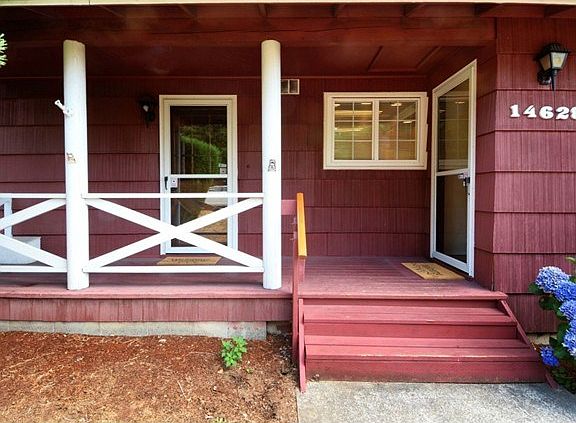 The big front porch welcomes visitors to the house. The door to